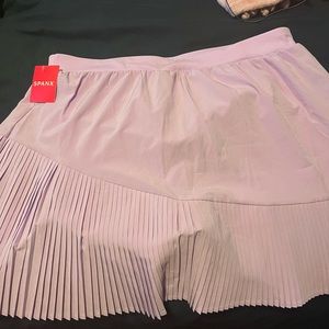 Brand new spanx skirt. Says XL but fits more like a large